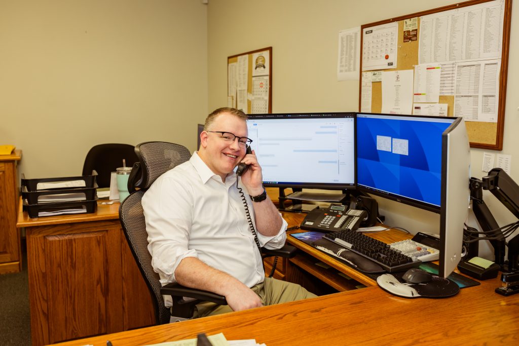 Customer service representative answering a phone.