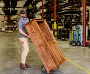 Delivery person in warehouse preparing for pickup