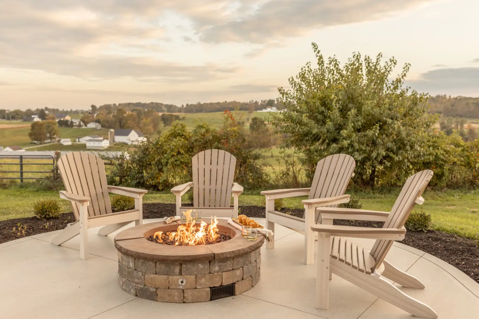 Chairs around a fire pit on a back patio