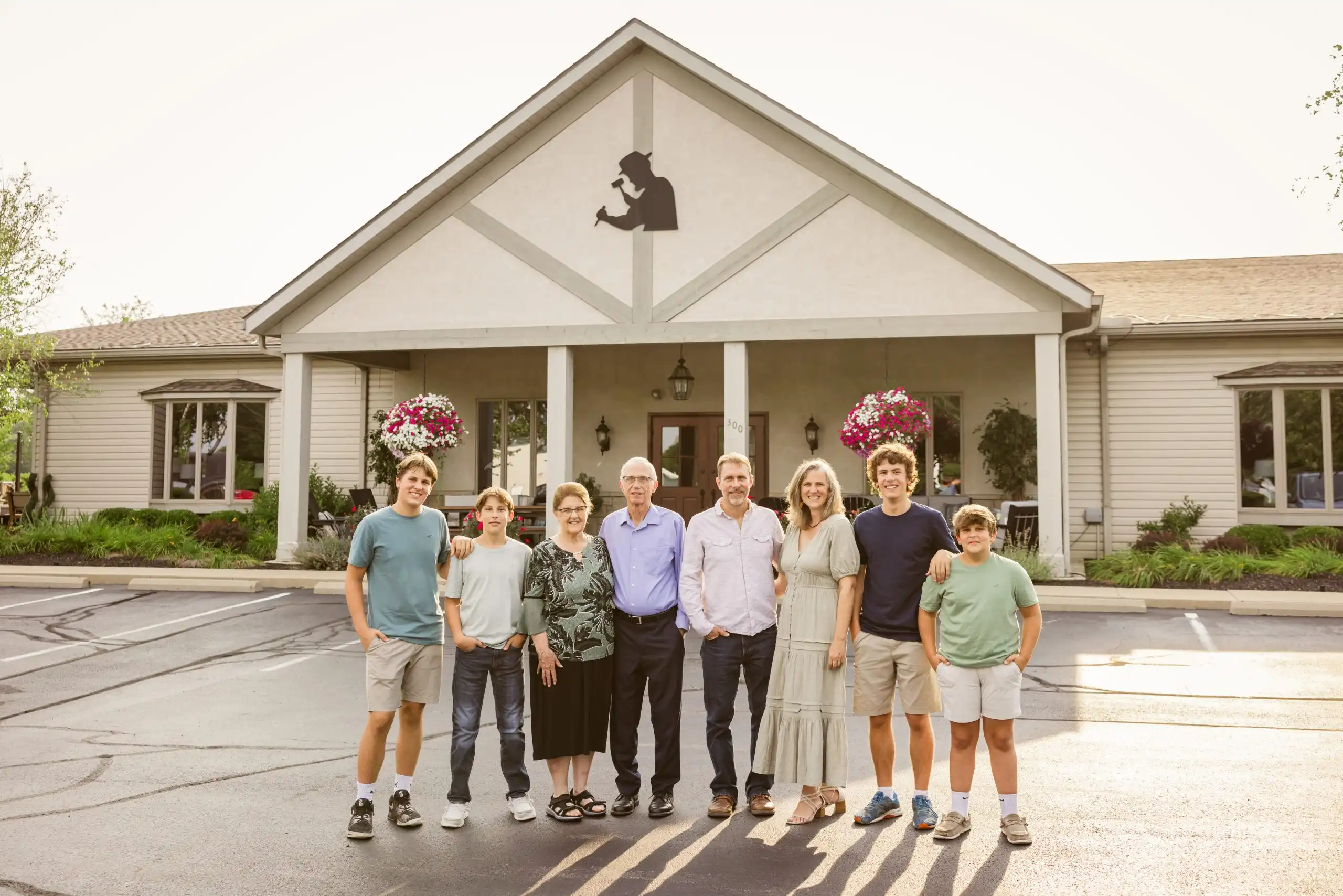 Family photo in front of Millwest Amish Furniture store in Plain City, OH